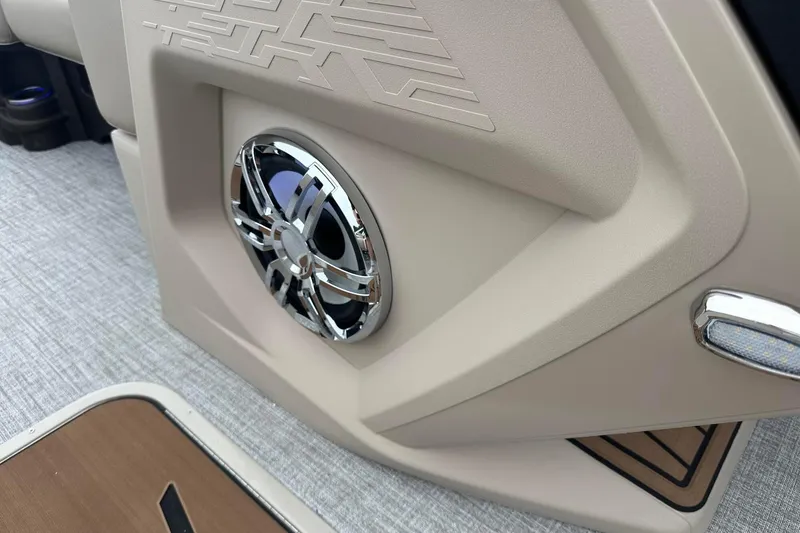 Slide: The Image of 2025 Tahoe 2385 interior speaker detail with modern design and chrome accents. - 23