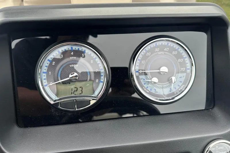 Slide: The Image of Dashboard of 2025 Tahoe 2385 showing RPM and speed gauges. - 26