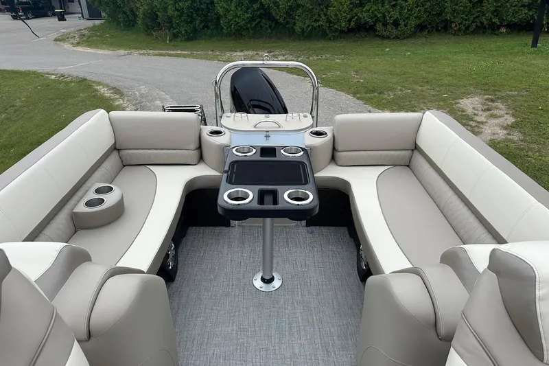 Slide: The Image of Luxurious interior of 2025 Tahoe 2385 boat with plush seating and cup holders. - 30