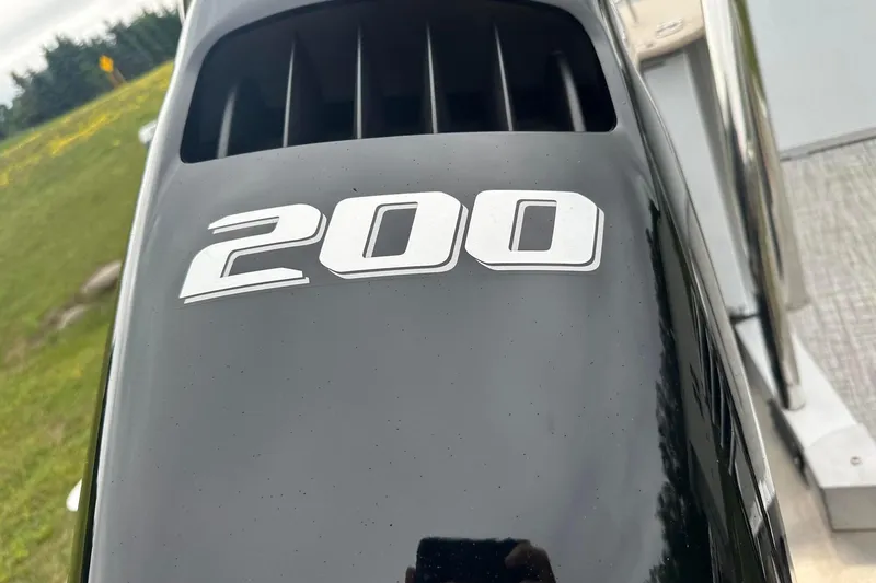 Slide: The Image of Close-up of a 2025 Tahoe 2385 engine cover with "200" marking. - 6