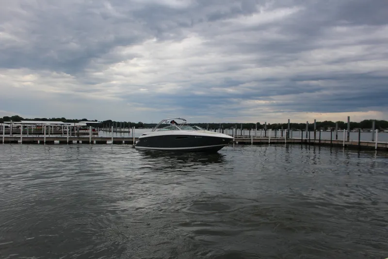 Slide: The Image of 2021 Cobalt R35 Surf boat docked on a cloudy day at a marina. - 3