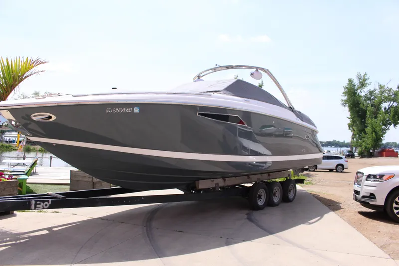 Slide: The Image of 2021 Cobalt R35 Surf boat on trailer, parked near waterfront. - 30