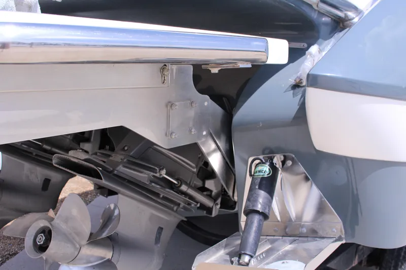 Slide: The Image of Close-up of 2021 Cobalt R35 Surf boat's propeller and trim tab system. - 35