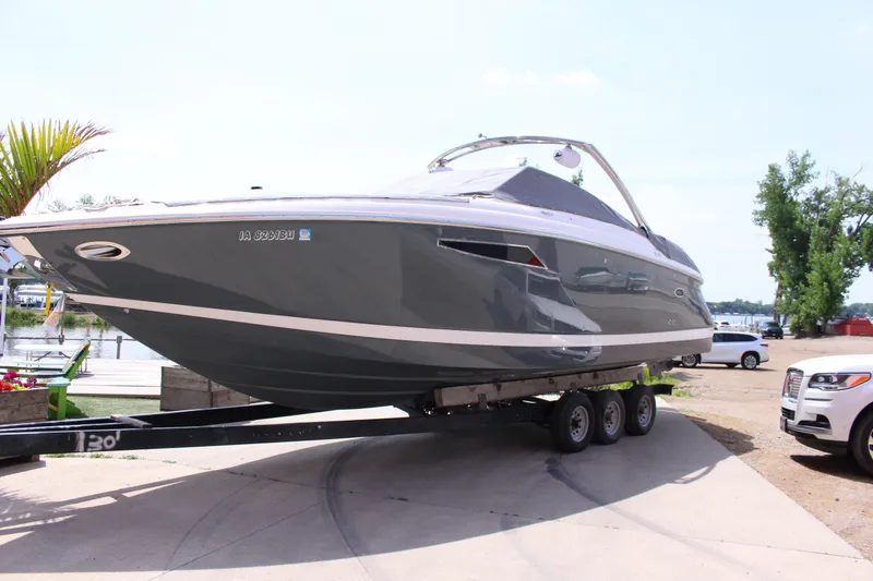 Slide: The Image of 2021 Cobalt R35 Surf boat on trailer, parked near waterfront. - 6