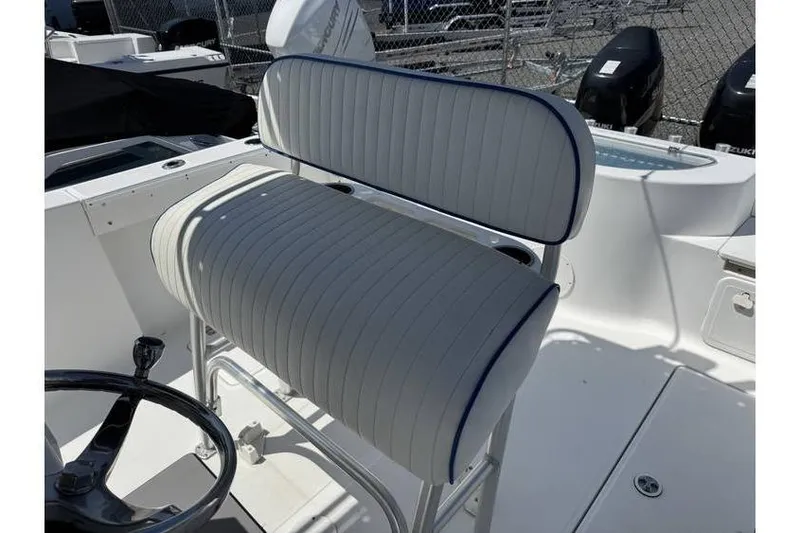 Slide: The Image of 2007 Sea Fox 256 boat interior with cushioned seating and steering wheel. - 5