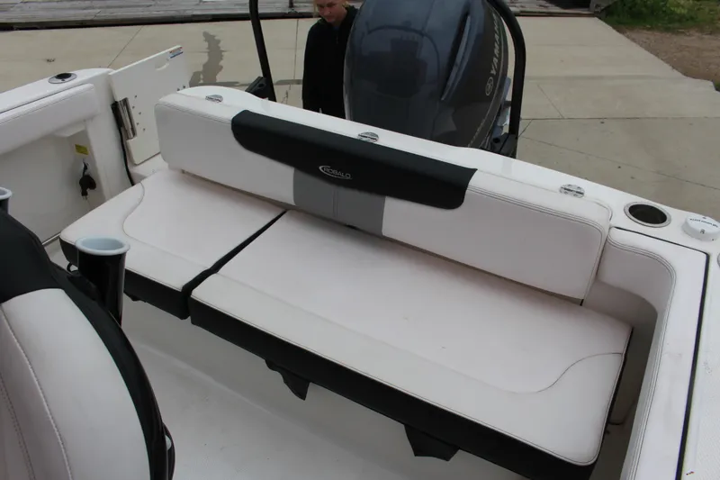Slide: The Image of 2021 Robalo 222EX boat interior with white seating and Yamaha engine. - 7