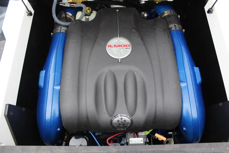 Slide: The Image of 2018 MasterCraft XT22 Ilmor engine with blue accents in boat compartment. - 15
