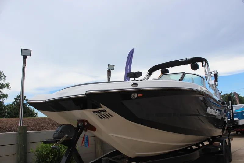 Slide: The Image of 2018 MasterCraft XT22 boat on display, showcasing sleek design and modern features. - 7