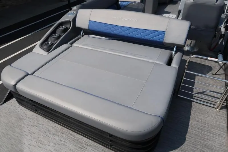 Slide: The Image of 2022 Bennington 23 LSB boat with luxurious gray seating and cup holders. - 14