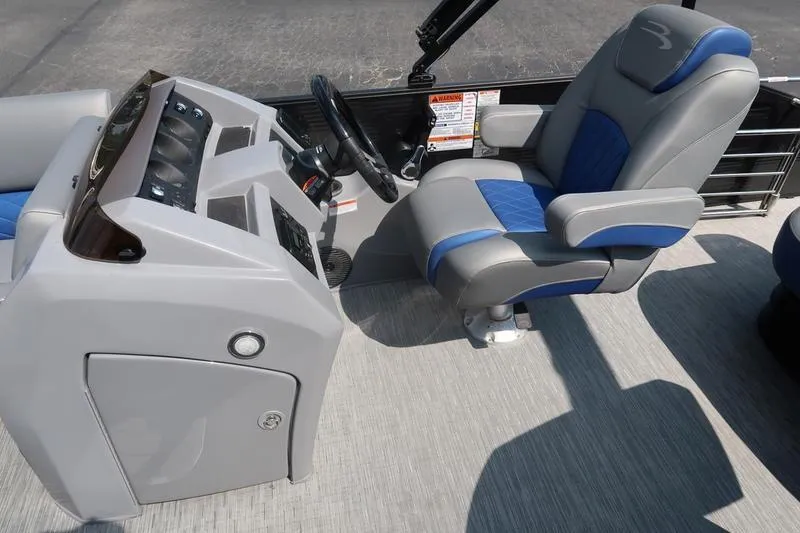 Slide: The Image of 2022 Bennington 23 LSB boat interior with steering console and captain's chair. - 22