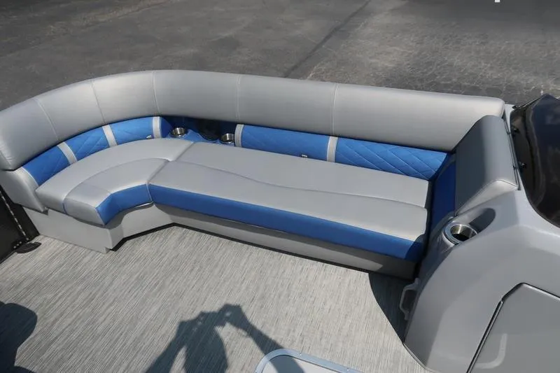 Slide: The Image of 2022 Bennington 23 LSB boat interior with gray and blue seating arrangement. - 25