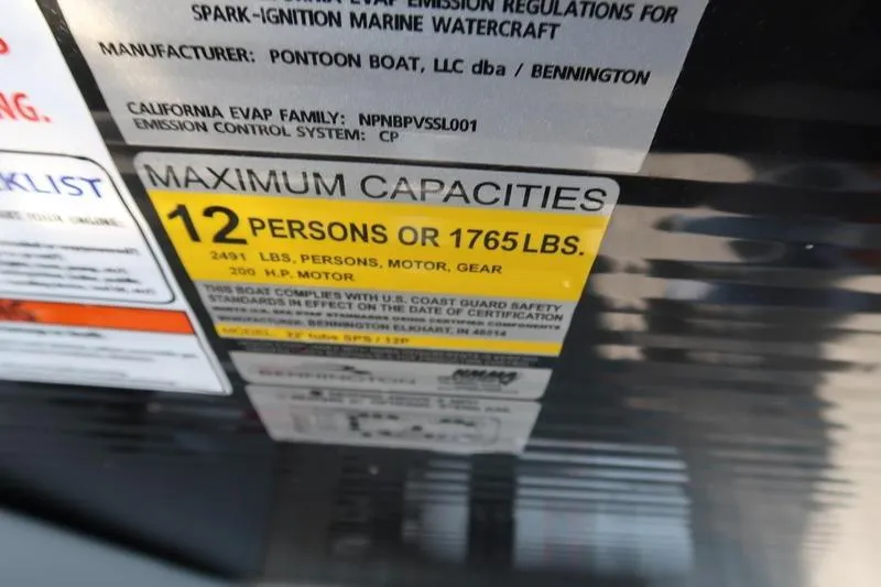 Slide: The Image of 2022 Bennington 23 LSB capacity label: 12 persons or 1765 lbs maximum. - 28