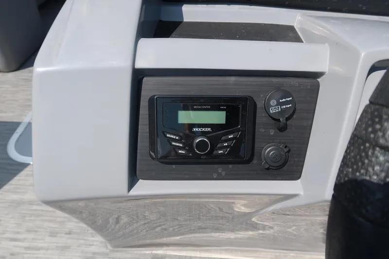 Slide: The Image of 2022 Bennington 23 LSB boat dashboard with Kicker media center and audio input. - 30
