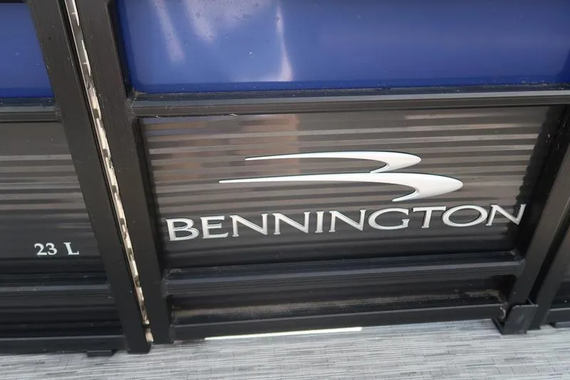 Slide: The Image of 2022 Bennington 23 LSB boat logo on black and blue panel. - 31