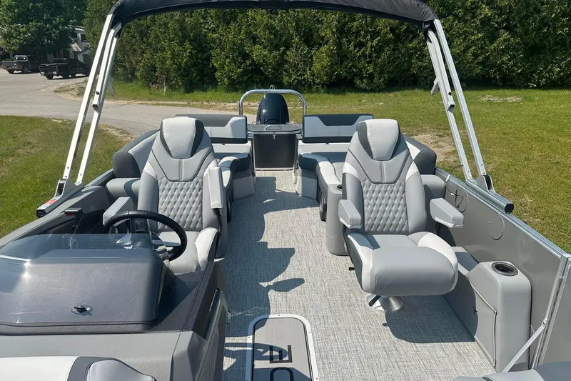 Slide: The Image of 2025 Tahoe 2385 boat interior with luxurious seating and modern design. - 14