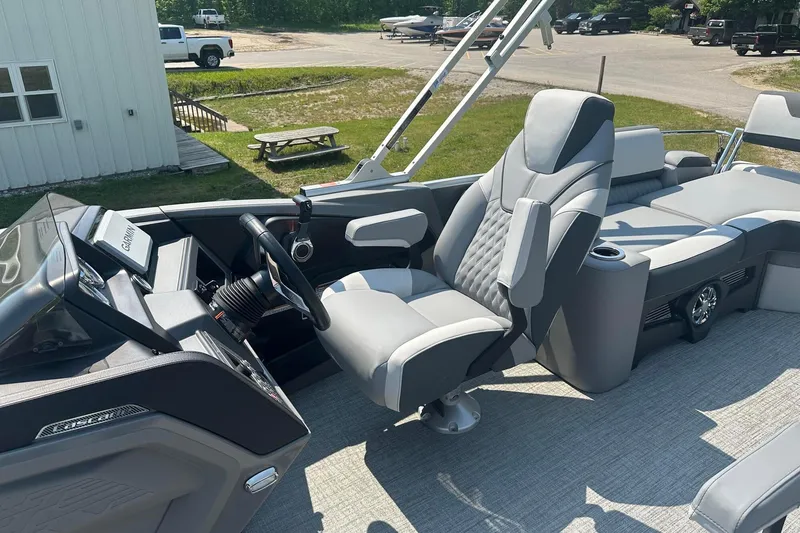 Slide: The Image of 2025 Tahoe 2385 boat interior with modern helm and comfortable seating. - 17