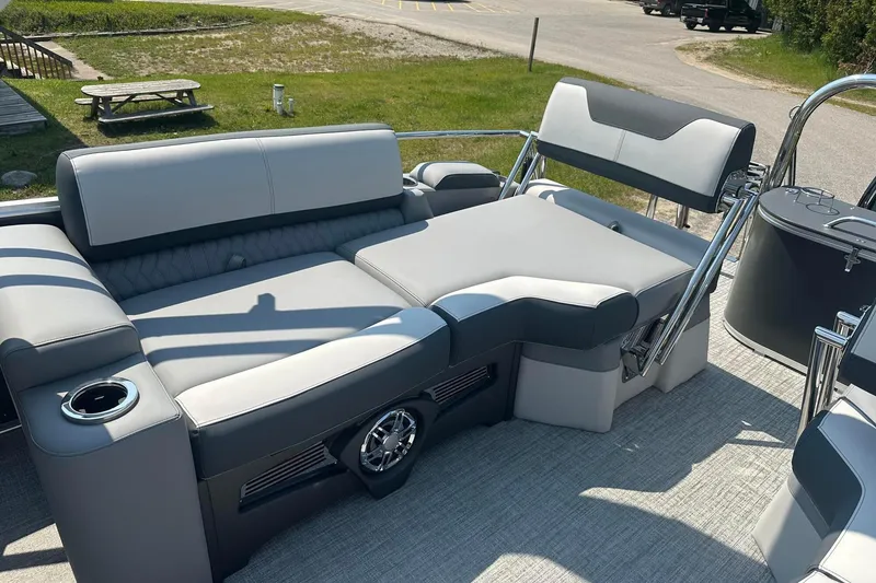 Slide: The Image of Luxurious seating on 2025 Tahoe 2385 pontoon boat with modern design and cup holder. - 18