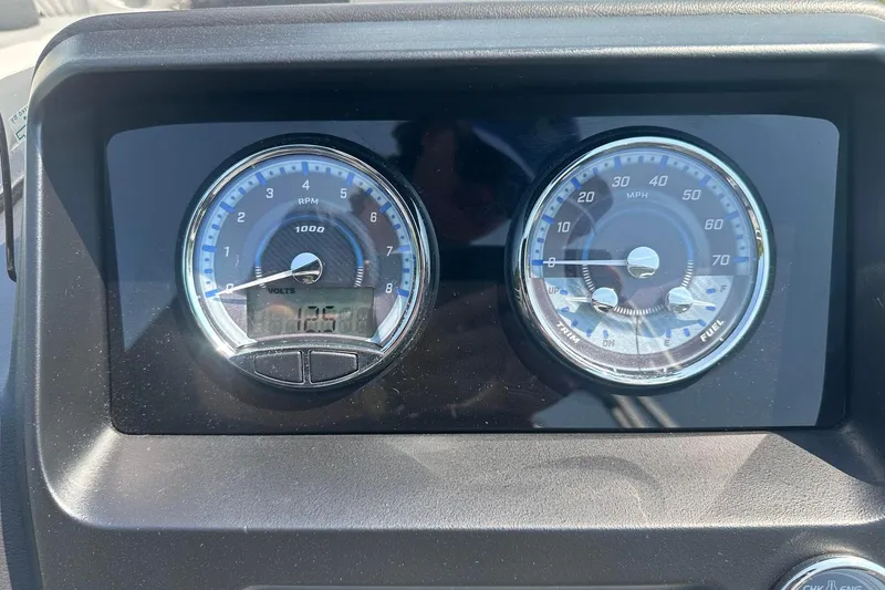 Slide: The Image of Dashboard of 2025 Tahoe 2385 showing RPM and speedometer gauges. - 20