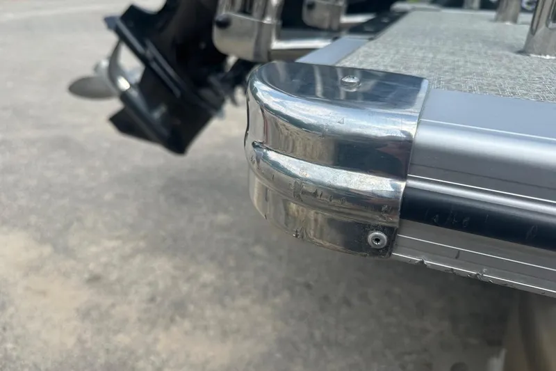 Slide: The Image of Close-up of 2025 Tahoe 2385 boat corner with metal trim detail. - 26
