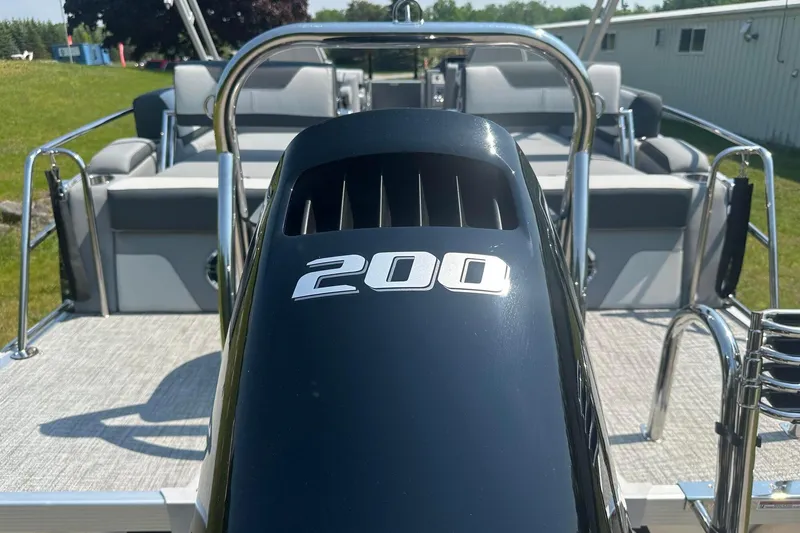 Slide: The Image of 2025 Tahoe 2385 boat with 200 HP engine, featuring sleek design and comfortable seating. - 6