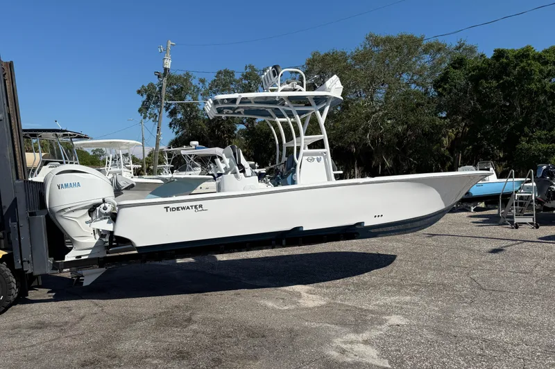 Slide: The Image of 2026 Tidewater 2500 Carolina Bay boat with Yamaha engine on a forklift. - 13
