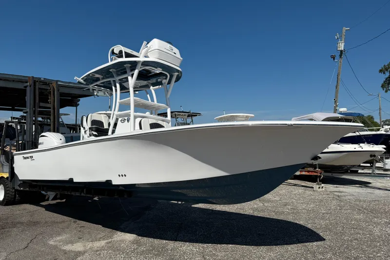 Slide: The Image of 2026 Tidewater 2500 Carolina Bay boat on display in a marina setting. - 14