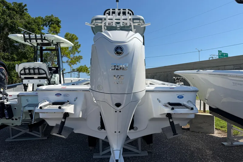 Slide: The Image of 2026 Tidewater 2500 Carolina Bay boat with powerful Yamaha V6 engine, displayed outdoors. - 19
