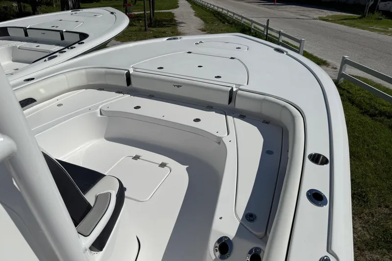 Slide: The Image of 2026 Tidewater 2500 Carolina Bay boat with Yamaha engine, displayed outdoors. - 20