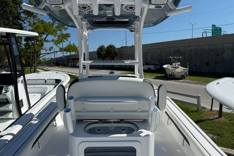 Slide: The Image of 2026 Tidewater 2500 Carolina Bay boat interior with seating and rod holders. - 9