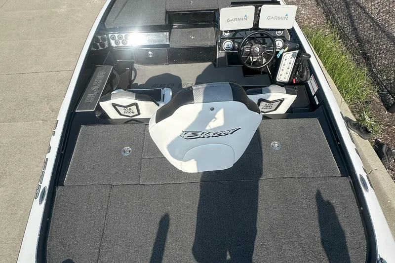 Slide: The Image of 2021 Blazer 650 Pro Tour boat interior with Garmin displays and steering wheel. - 12