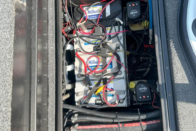 Slide: The Image of Battery compartment of a 2021 Blazer 650 Pro Tour with wiring and components. - 19