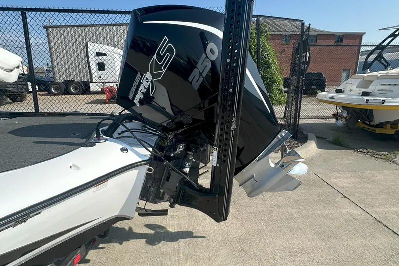Slide: The Image of 2021 Blazer 650 Pro Tour boat with Mercury Pro XS 250 engine in a marina. - 20