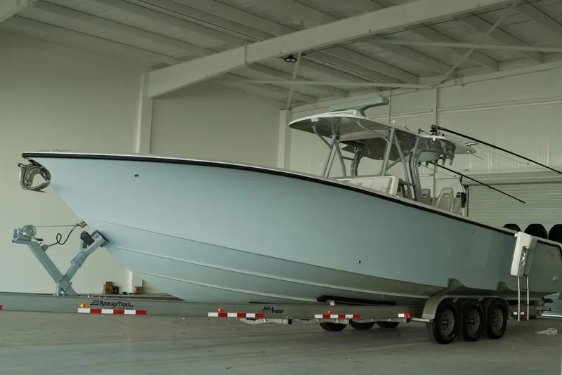 Slide: The Image of 2021 SeaVee 390Z boat on trailer in a spacious indoor facility. - 3