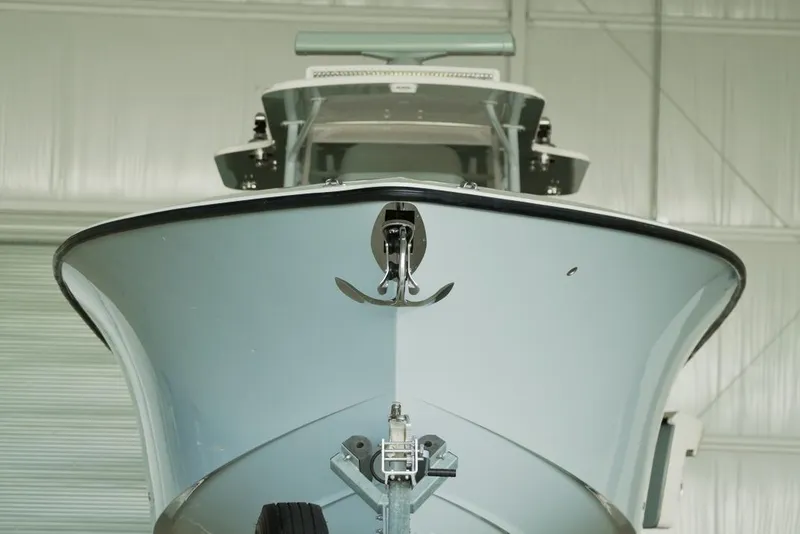 Slide: The Image of 2021 SeaVee 390Z boat in a garage, front view with anchor visible. - 5