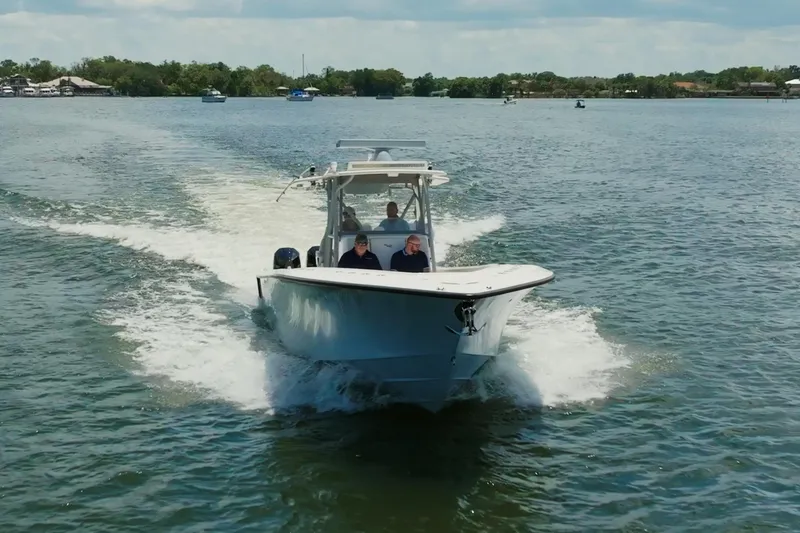Slide: The Image of 2021 SeaVee 390Z boat cruising on a sunny day in open water. - 8