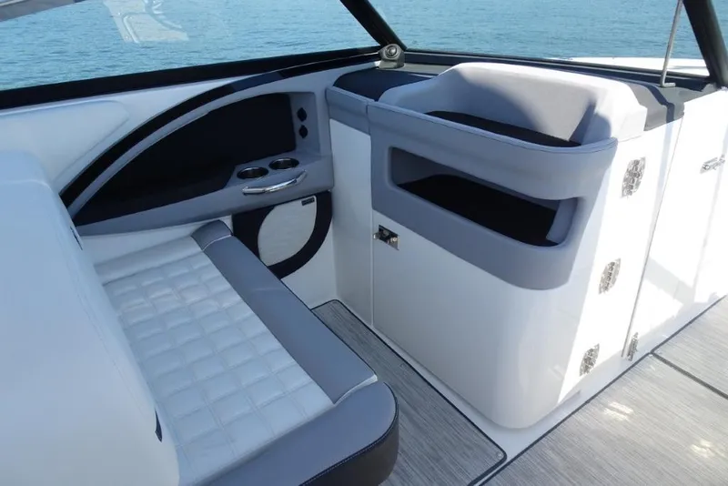 Slide: The Image of Luxurious interior of 2025 Cobalt R30 boat with modern seating and cup holders. - 15