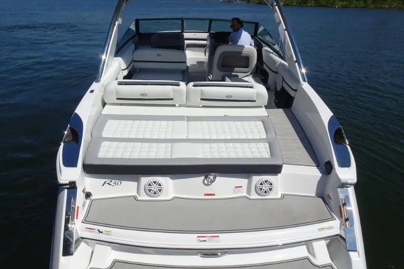 Slide: The Image of 2025 Cobalt R30 boat with spacious seating and sleek design on the water. - 8