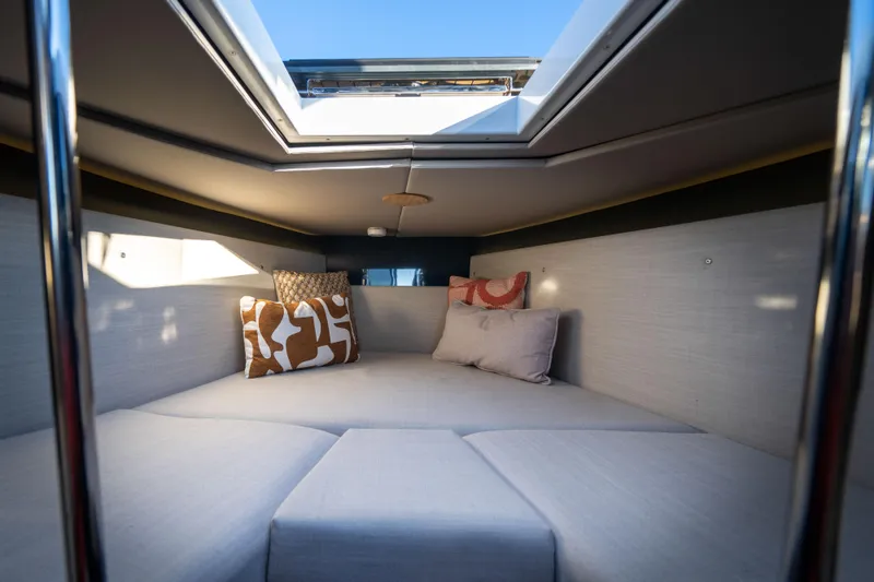 Slide: The Image of Interior of 2023 Arksen 30 boat cabin with skylight and decorative pillows. - 41