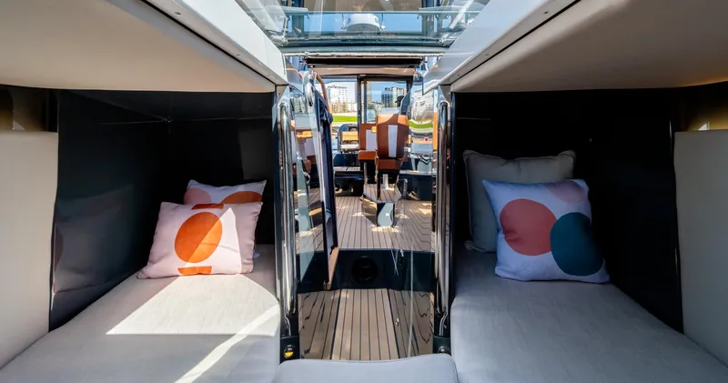 Slide: The Image of Interior of 2023 Arksen 30 yacht with twin beds and colorful pillows. - 46