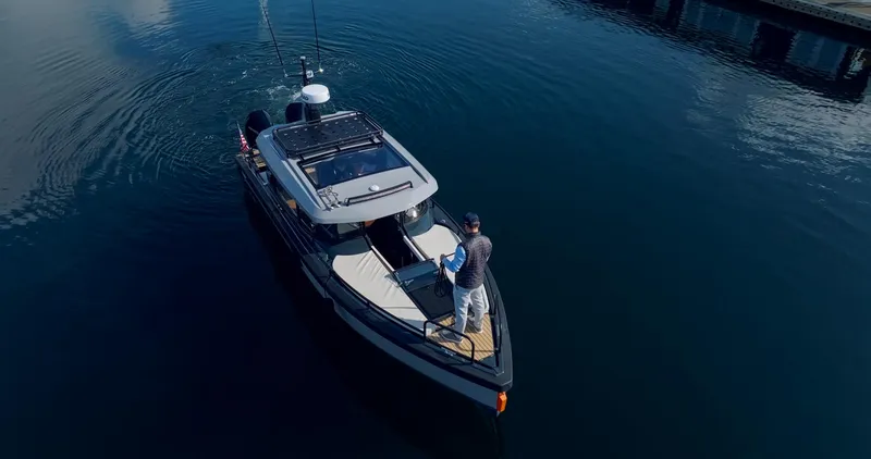 Slide: The Image of Aerial view of 2023 Arksen 30 boat on calm water. - 7