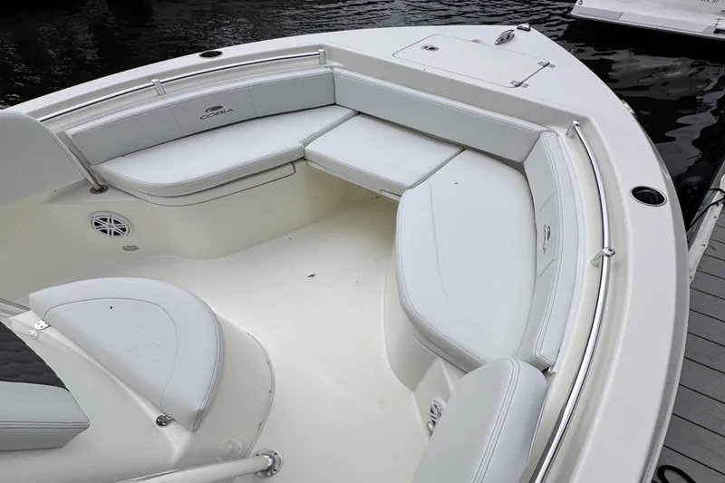 Slide: The Image of 2026 Cobia 220 Center Console boat with spacious seating and sleek design. - 14