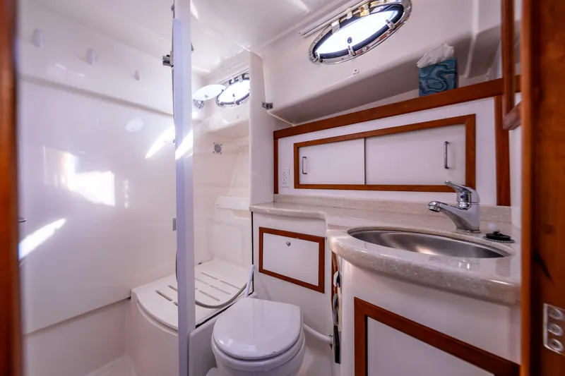 Slide: The Image of Luxurious bathroom in 2013 Back Cove 37 yacht, featuring modern fixtures and elegant wood accents. - 20