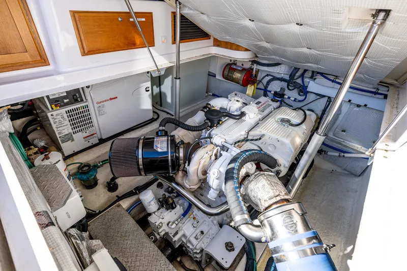 Slide: The Image of Engine room of 2013 Back Cove 37 boat, showcasing mechanical components and equipment. - 37