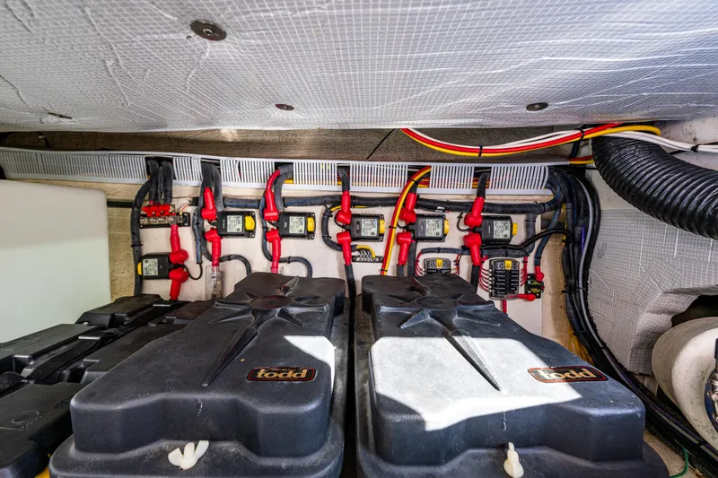 Slide: The Image of Electrical system of a 2013 Back Cove 37 boat, featuring batteries and wiring. - 39