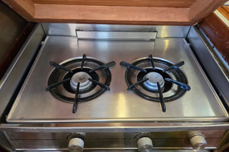 Slide: The Image of Stainless steel two-burner stove in a 1992 Hunter 35.5 model boat kitchen. - 10