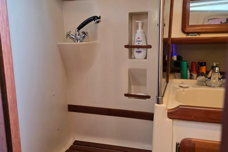 Slide: The Image of Bathroom interior of a 1992 Hunter 35.5 sailboat with sink and toiletries. - 17
