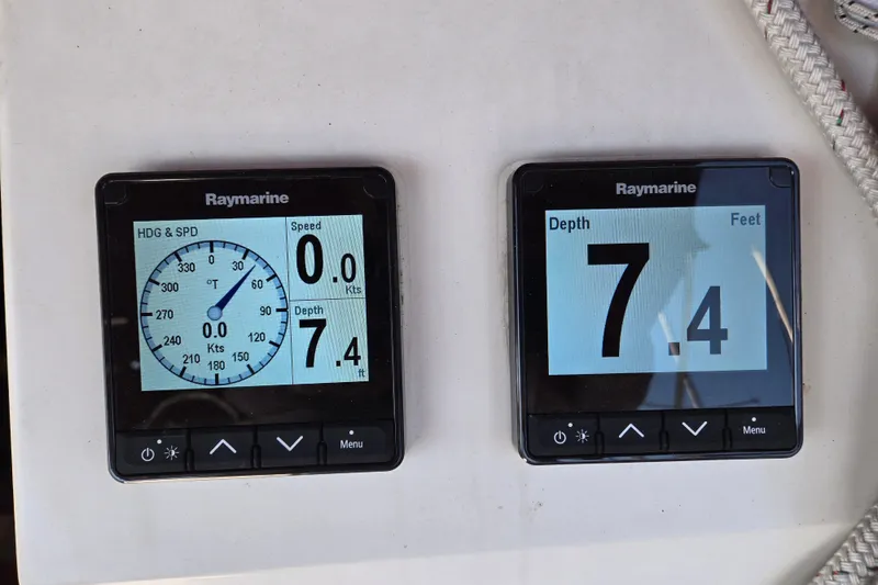 Slide: The Image of Raymarine navigation displays on a 1992 Hunter 35.5 sailboat, showing speed and depth. - 24