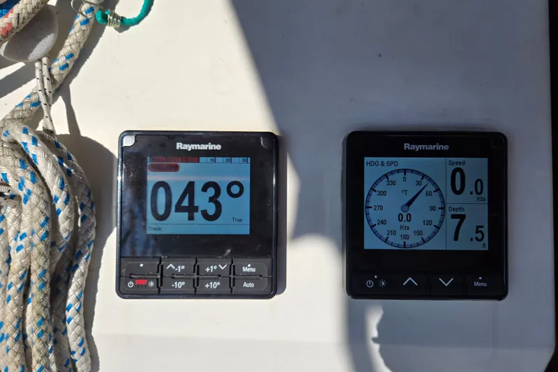 Slide: The Image of Raymarine navigation instruments on a 1992 Hunter 35.5 sailboat, displaying heading and depth. - 25
