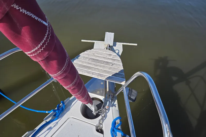 Slide: The Image of Bow of 1992 Hunter 35.5 sailboat with anchor and maroon sail cover. - 31