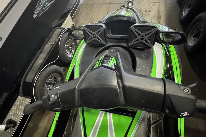 Slide: The Image of 2021 Yamaha WaveRunner FX SHO in green, parked indoors, top view. - 3